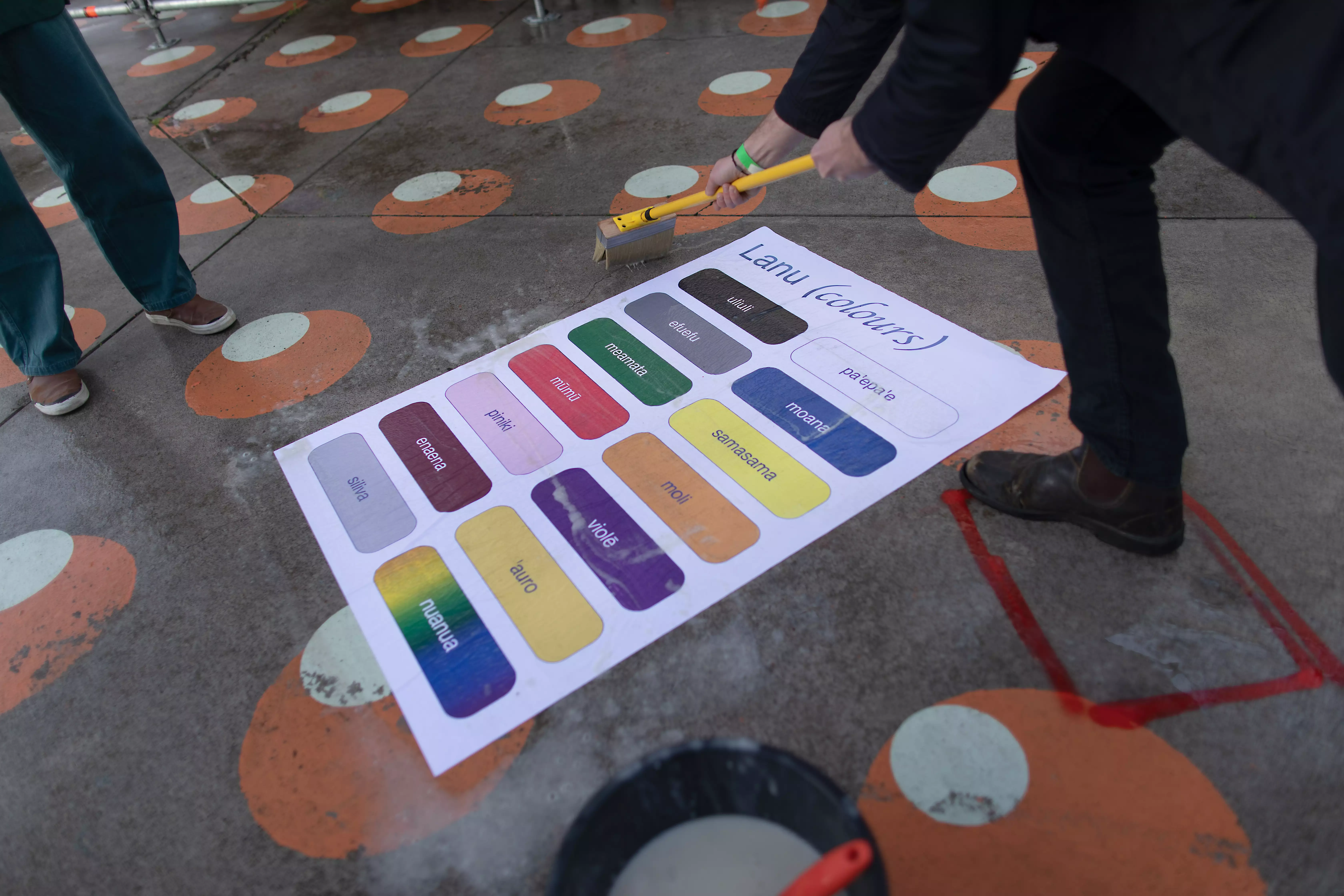 A poster installed on the ground promoting Samoan Language Week depicting colours in Samoan.
