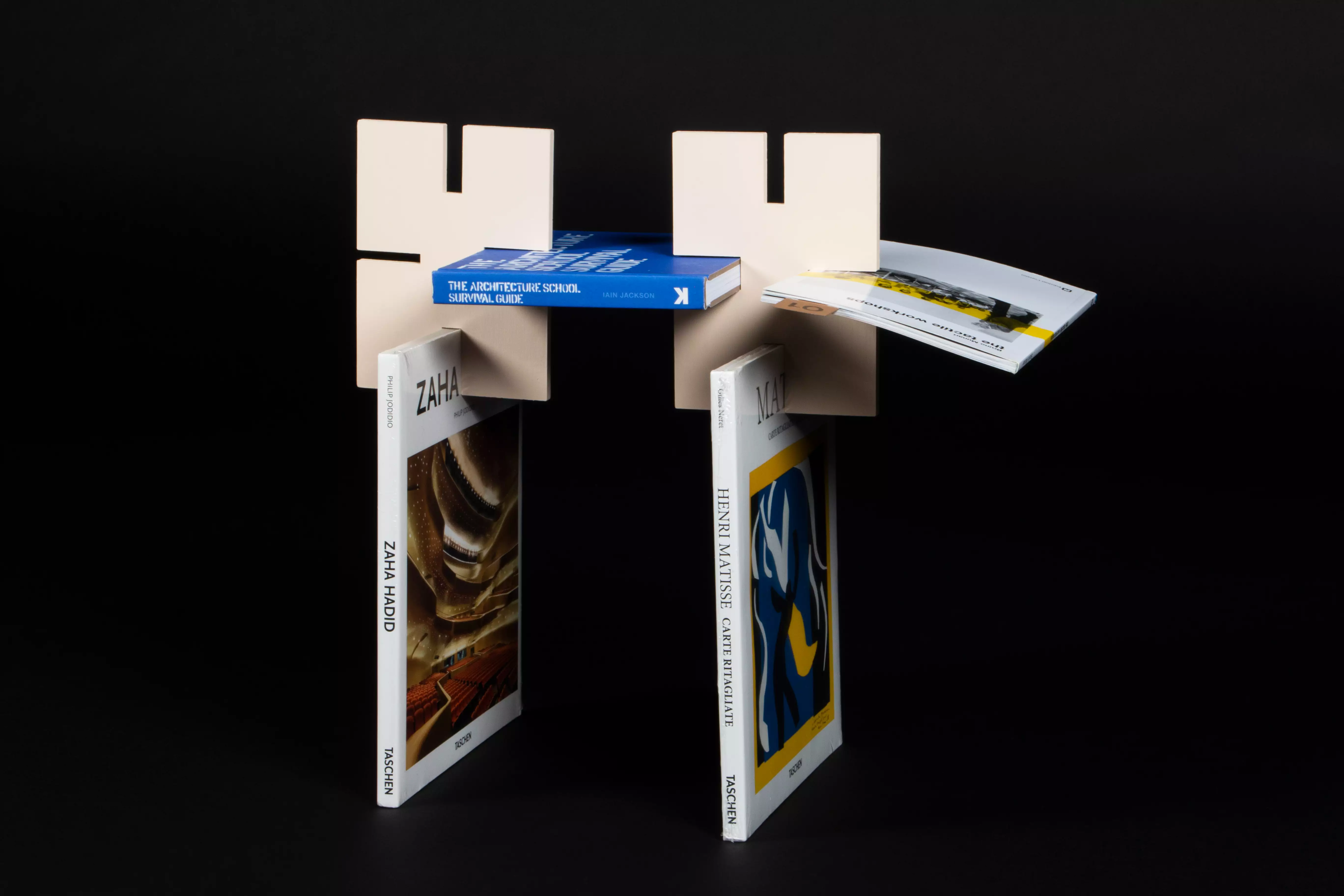 A bookshelf made up of pieces that connect books together to create structure.