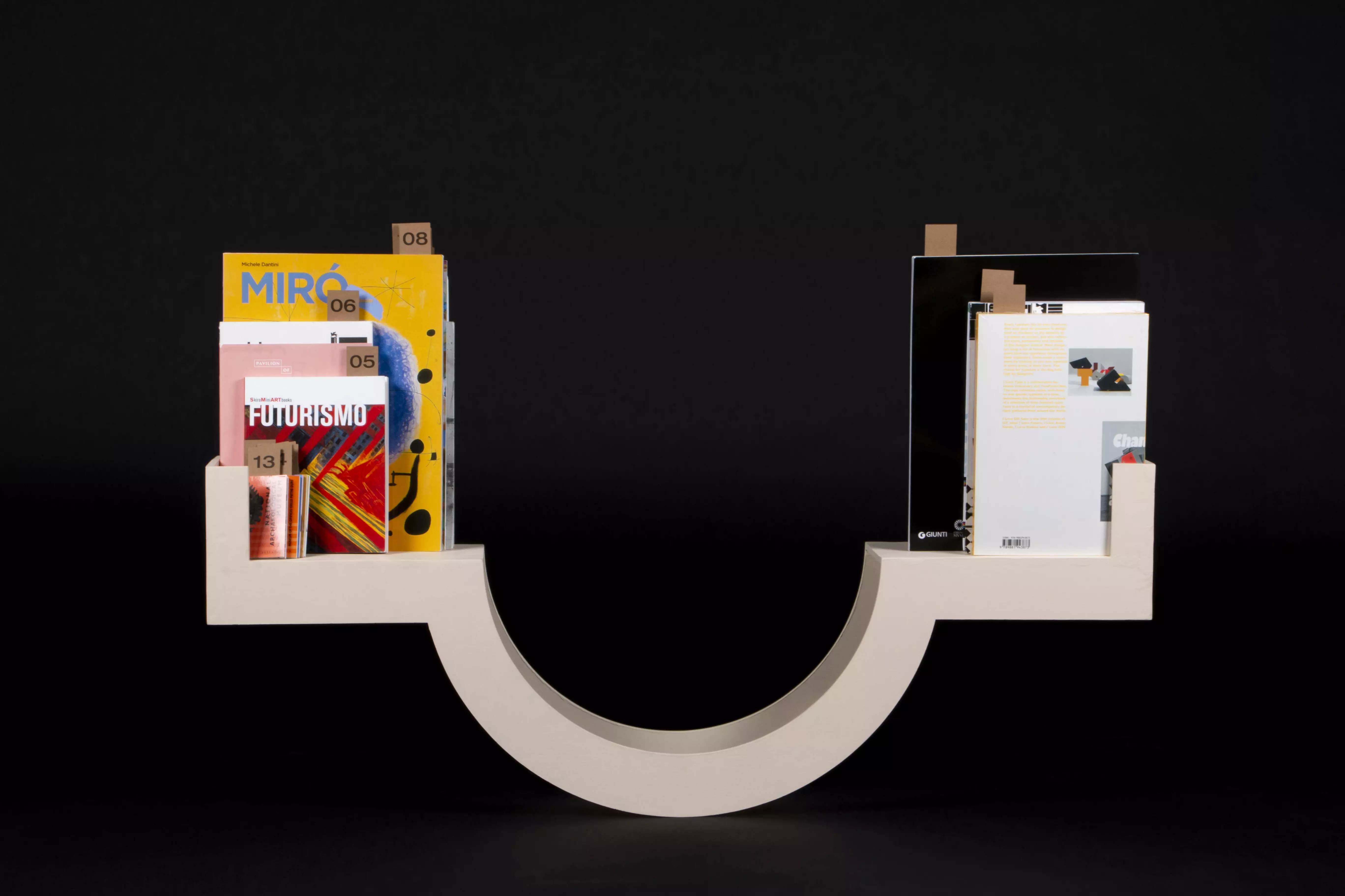 A see-saw style bookshelf where the combined weight of the books on either side balance each other.